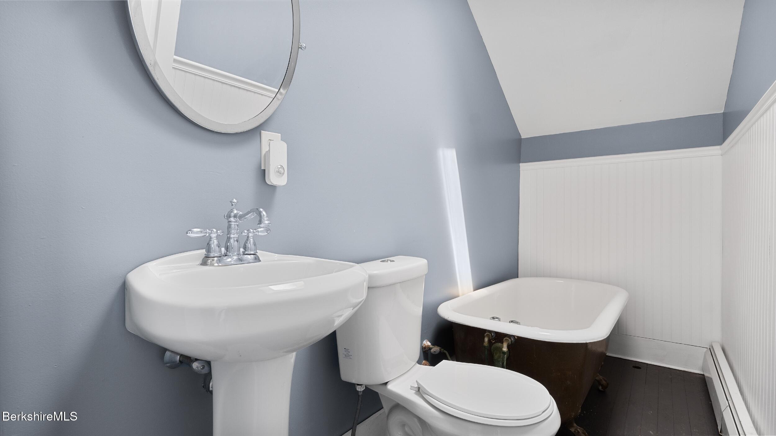 20 East Dugway Road Lenox, MA 01240 - Photo 40 of 84 a bathroom with a toilet a sink and mirror