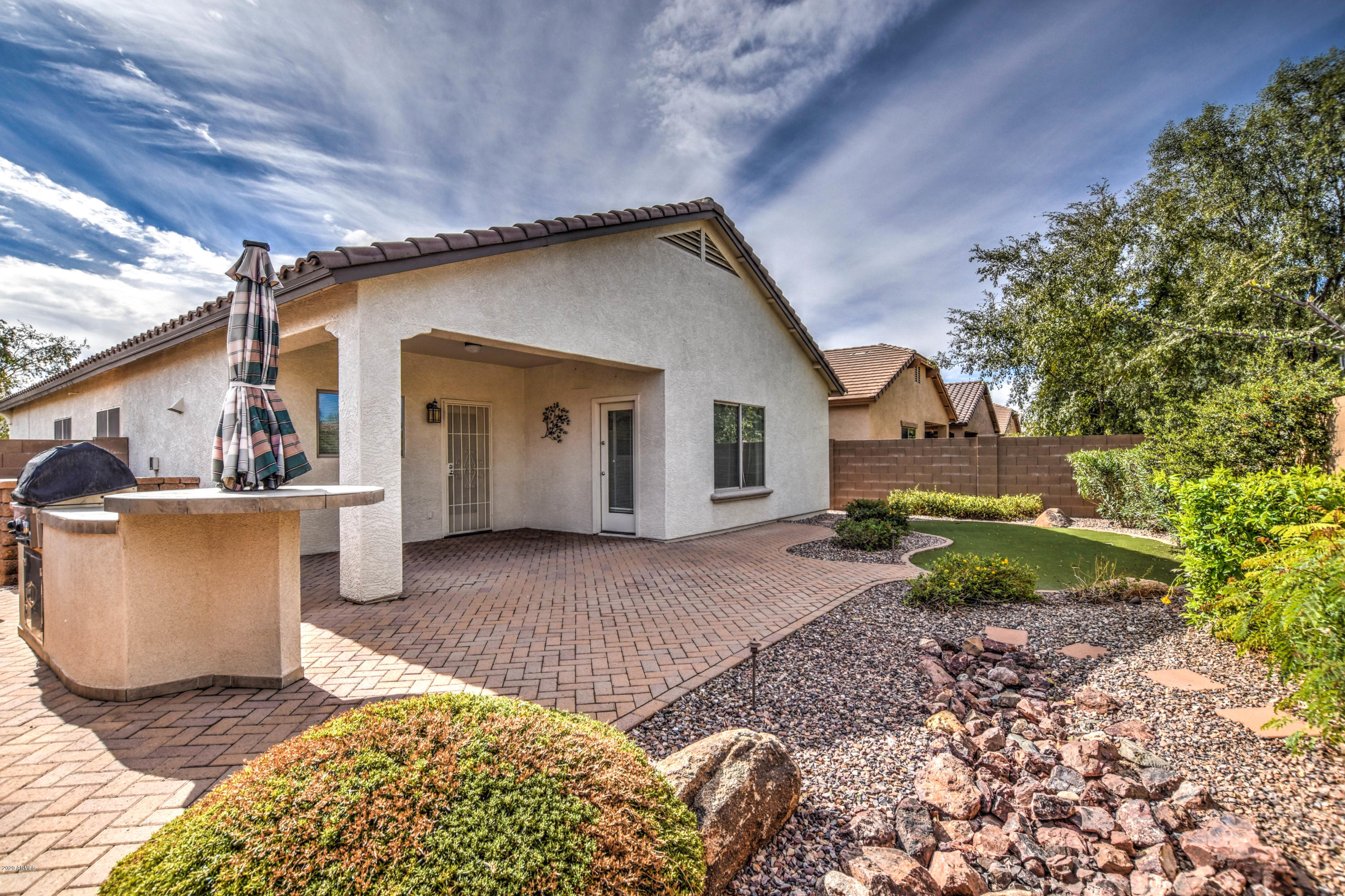 7582 West Springfield Way Florence, AZ 85132 - Photo 3 of 42 Back patio and landscaping