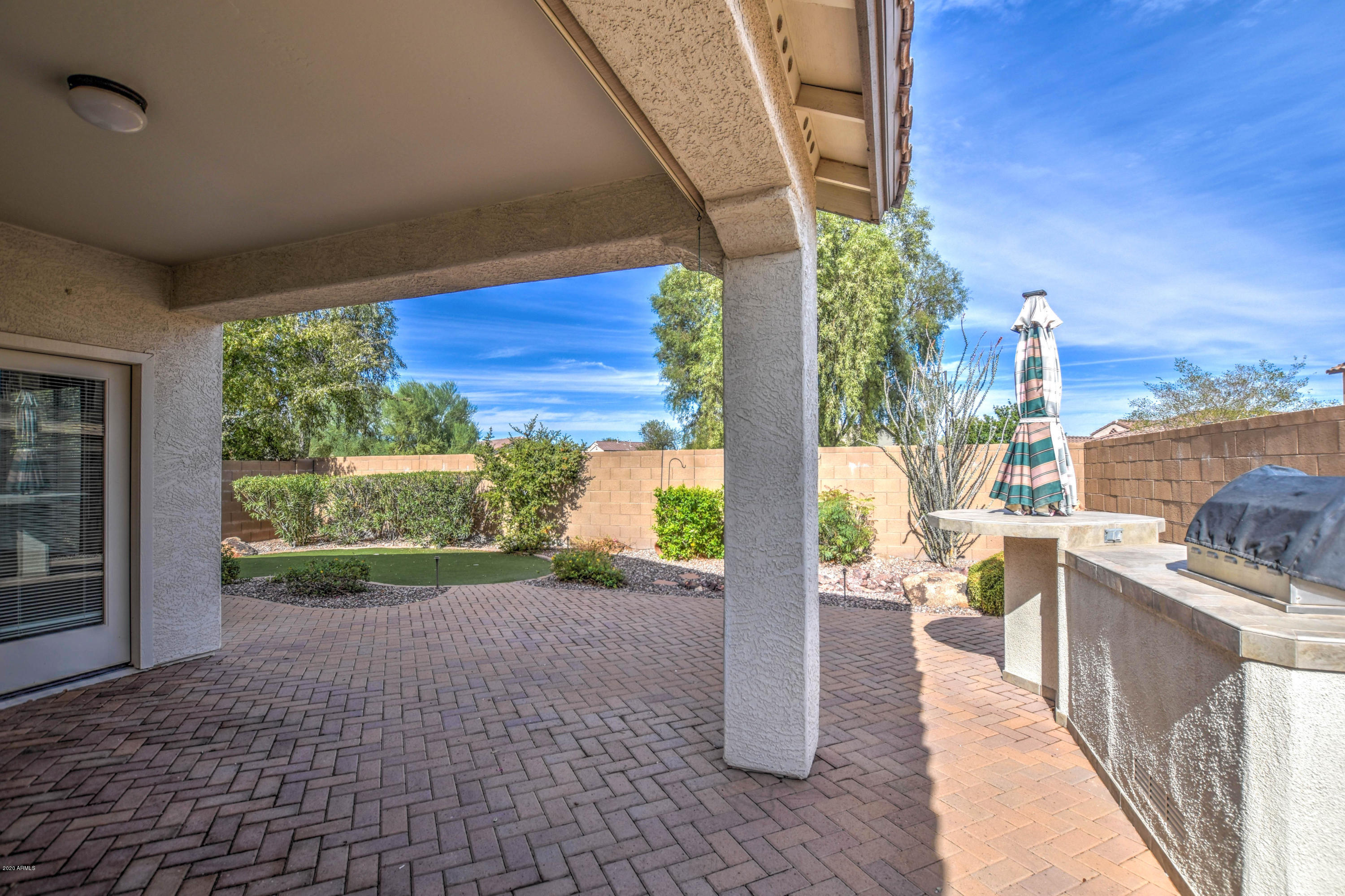 7582 West Springfield Way Florence, AZ 85132 - Photo 4 of 42 Back patio and BBQ