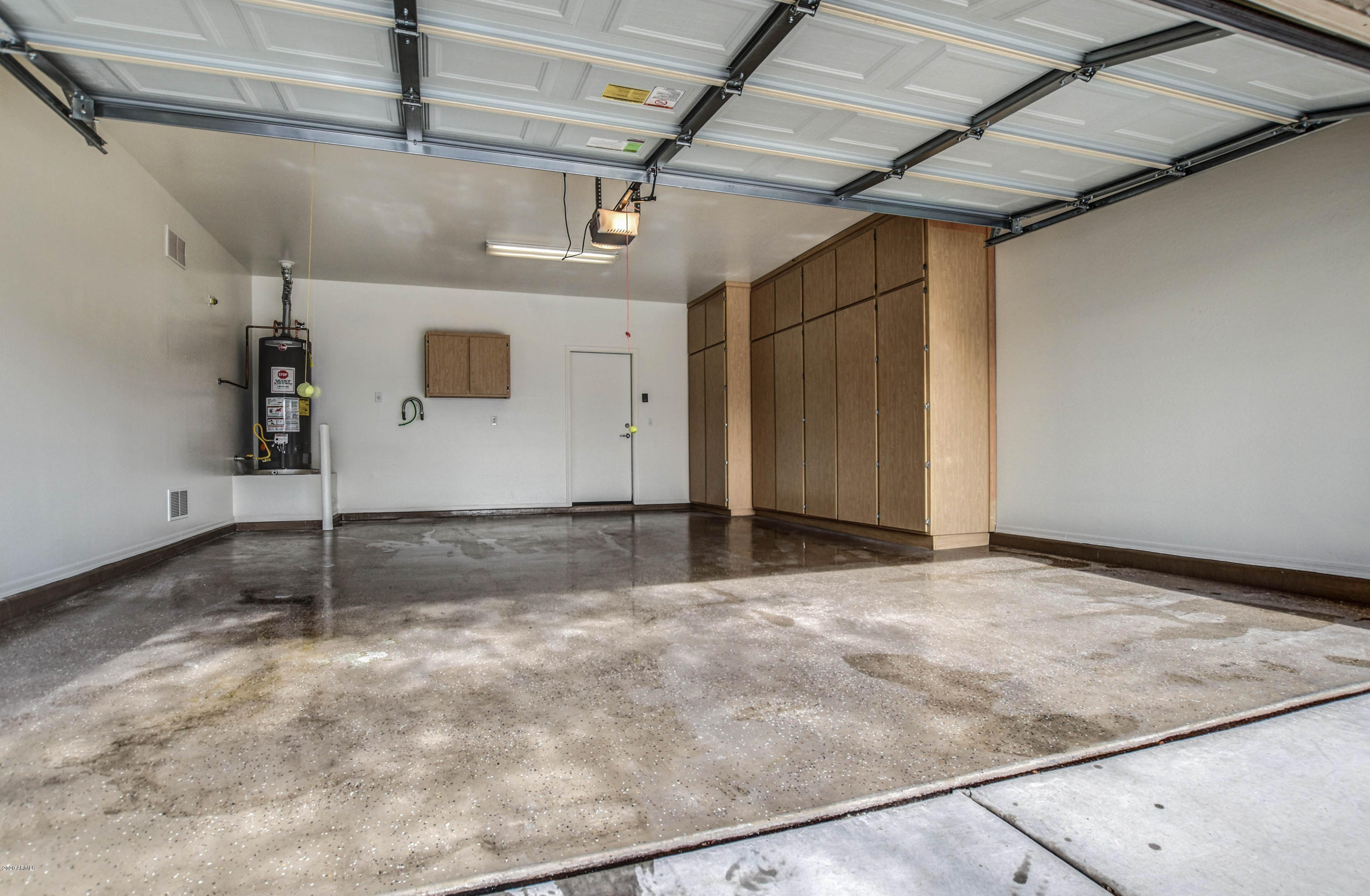 7582 West Springfield Way Florence, AZ 85132 - Photo 42 of 42 Garage epoxy floors and storage