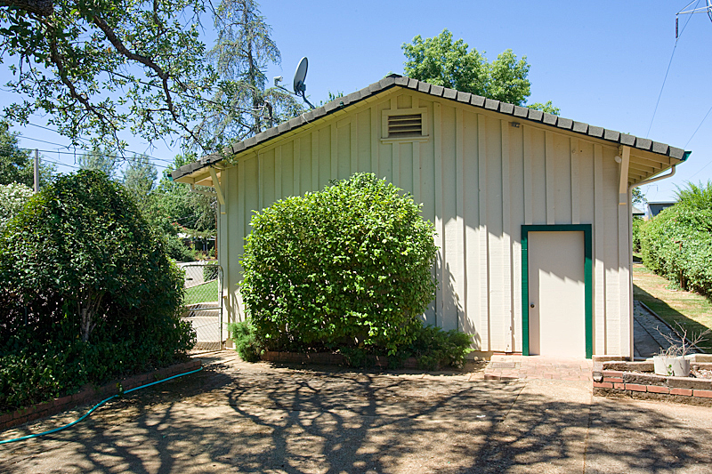 1710 Barbara Road Redding, CA 96003 - Photo 3 of 23 a front view of a house with garden