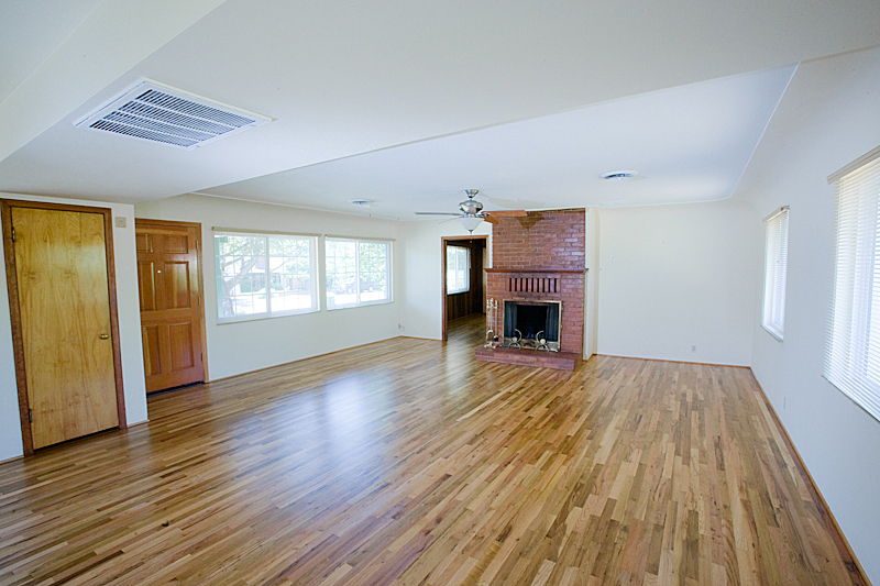 1710 Barbara Road Redding, CA 96003 - Photo 5 of 23 a view of empty room with wooden floor and fireplace
