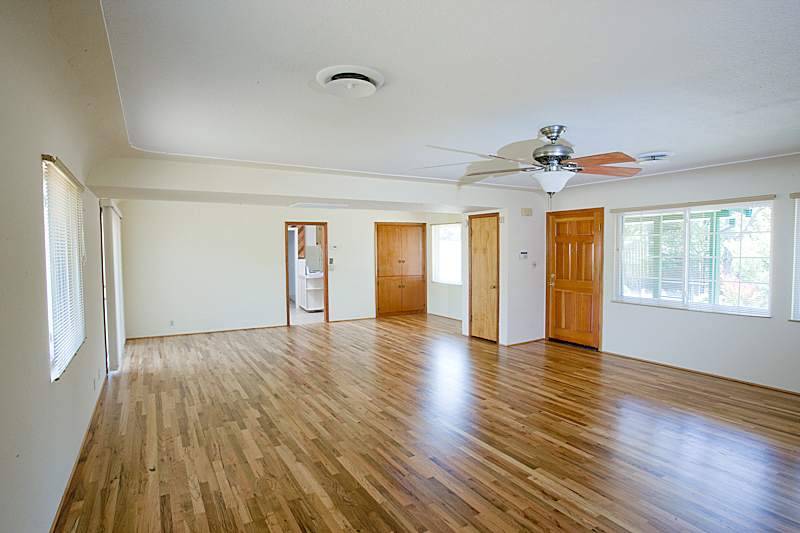 1710 Barbara Road Redding, CA 96003 - Photo 6 of 23 a view of an empty room with wooden floor and a window