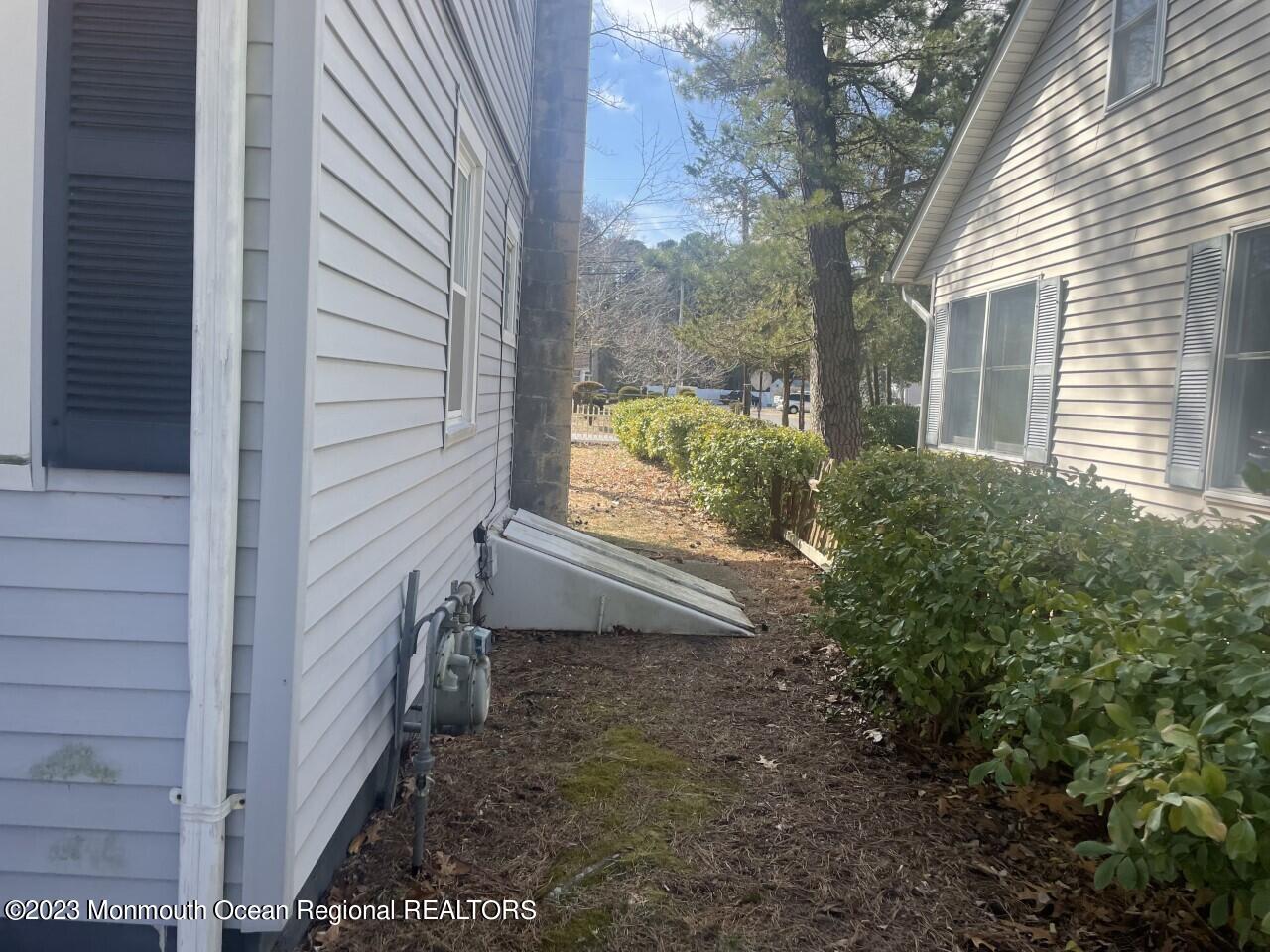 691 Mantoloking Road Brick, NJ 08723 - Photo 5 of 16 a view of house with backyard