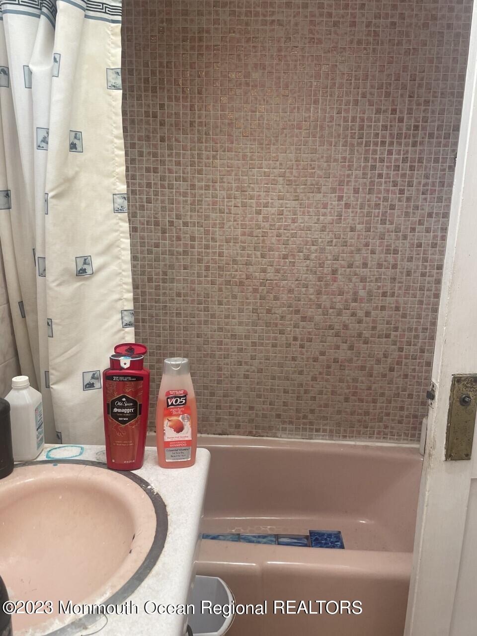 691 Mantoloking Road Brick, NJ 08723 - Photo 10 of 16 a bathroom with a bath tub