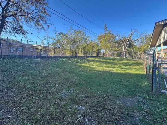 a view of a field with a big yard