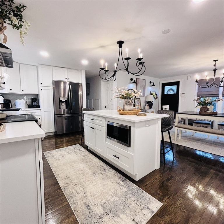 20 Morgan Road Holbrook, MA 02343 - Photo 9 of 21 a kitchen that has a lot of white cabinets and stainless steel appliances
