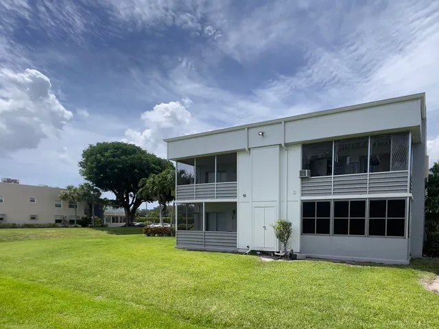 a view of a livingroom with furniture and windows