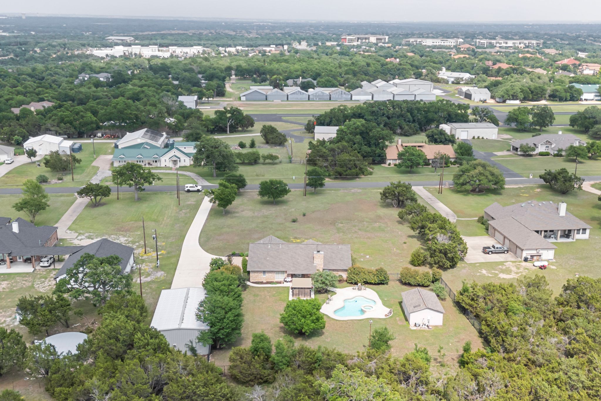 221 Breakaway Road Cedar Park, TX 78613 - Photo 7 of 39 Aerial view of residential area with a pool area