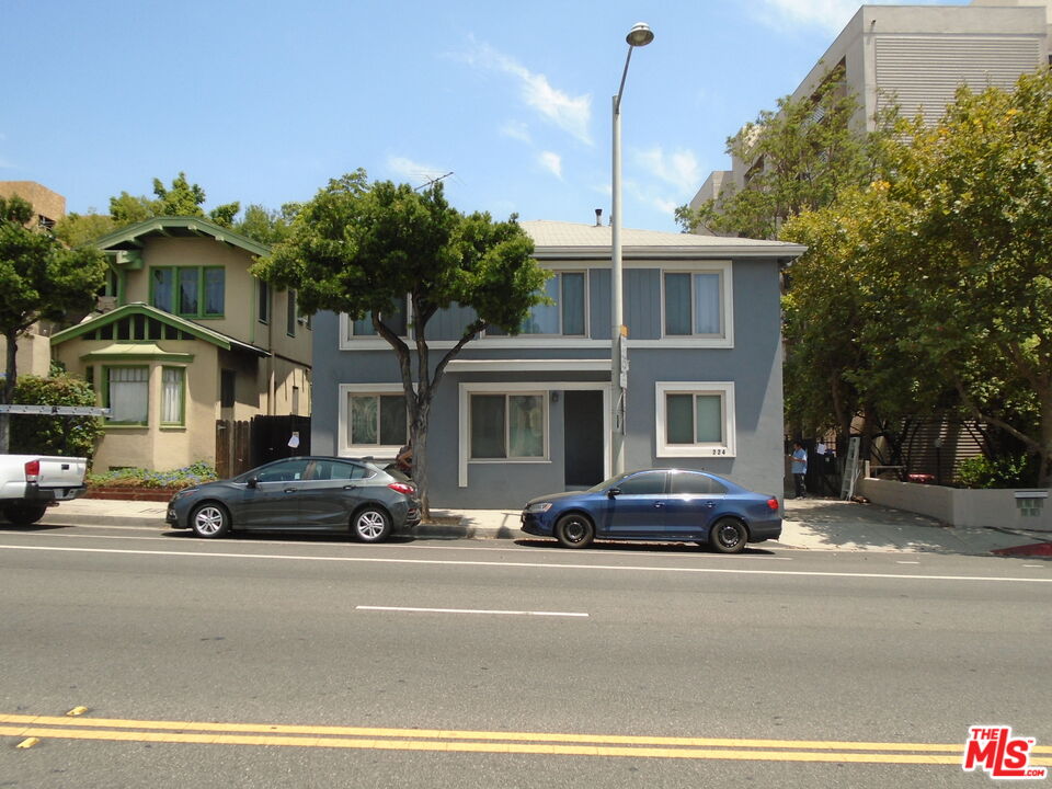 a view of a car parked in front of a building