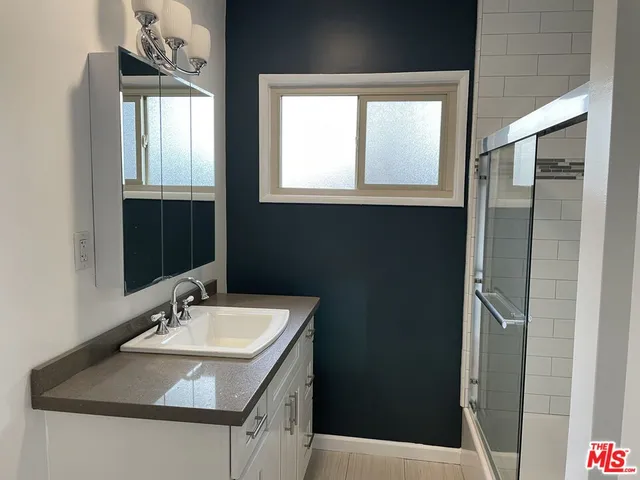 a bathroom with a sink and a mirror