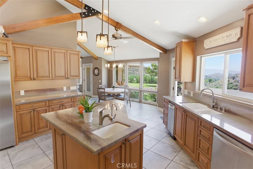 31233 Romero Canyon Road Castaic, CA 91384 - Photo 15 of 38 a kitchen with a sink stove and cabinets