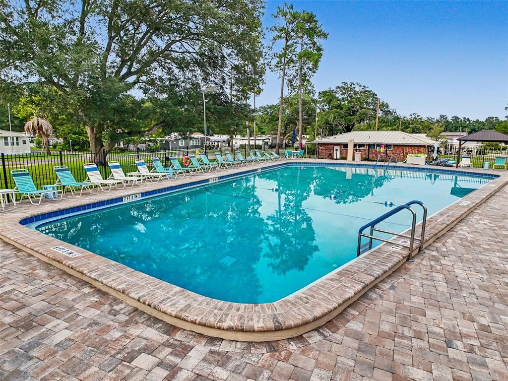 2092 Culbreath Road, Unit A42 Brooksville, FL 34602 - Photo 37 of 70 a view of a swimming pool with a patio