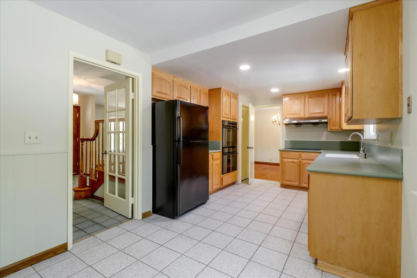 6908 Burnside Drive San Jose, CA 95120 - Photo 11 of 37 a kitchen with a refrigerator and a sink