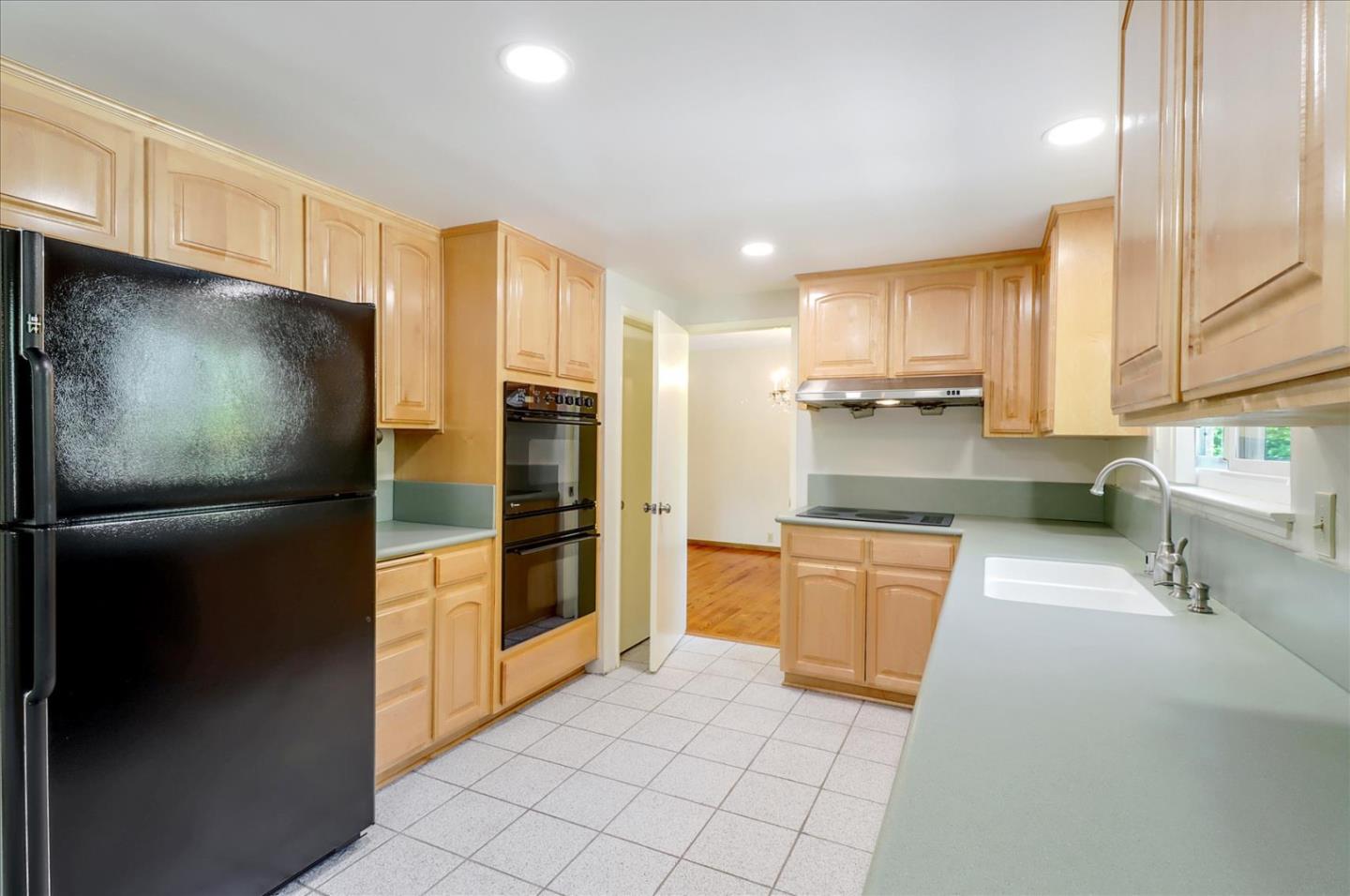 6908 Burnside Drive San Jose, CA 95120 - Photo 12 of 37 a kitchen with stainless steel appliances a refrigerator and a sink
