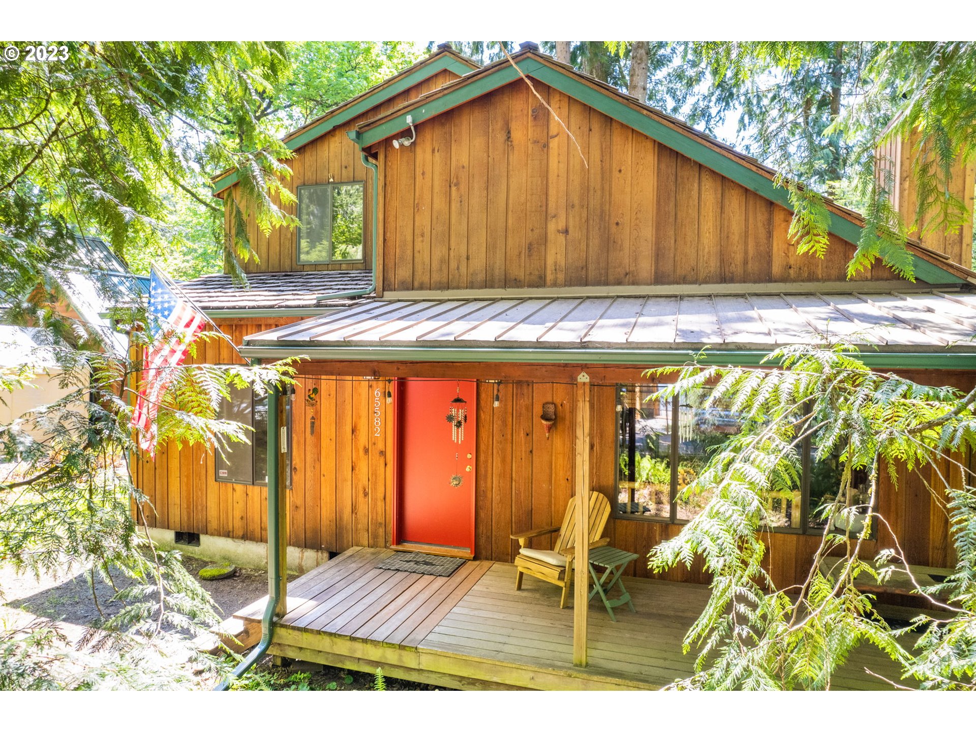 a view of backyard with wooden fence