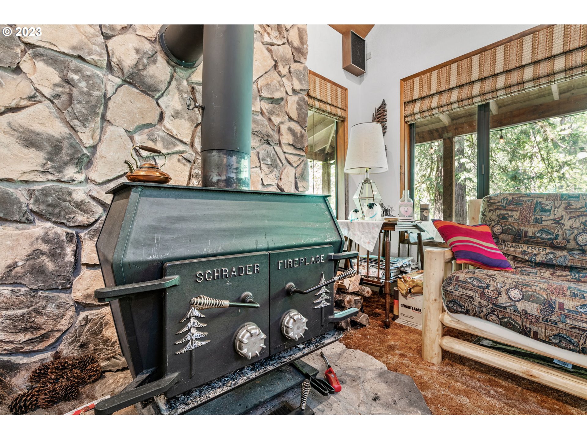 65582 East Timberline Drive Rhododendron, OR 97049 - Photo 11 of 48 a view of a wooden door with a bench and a couch