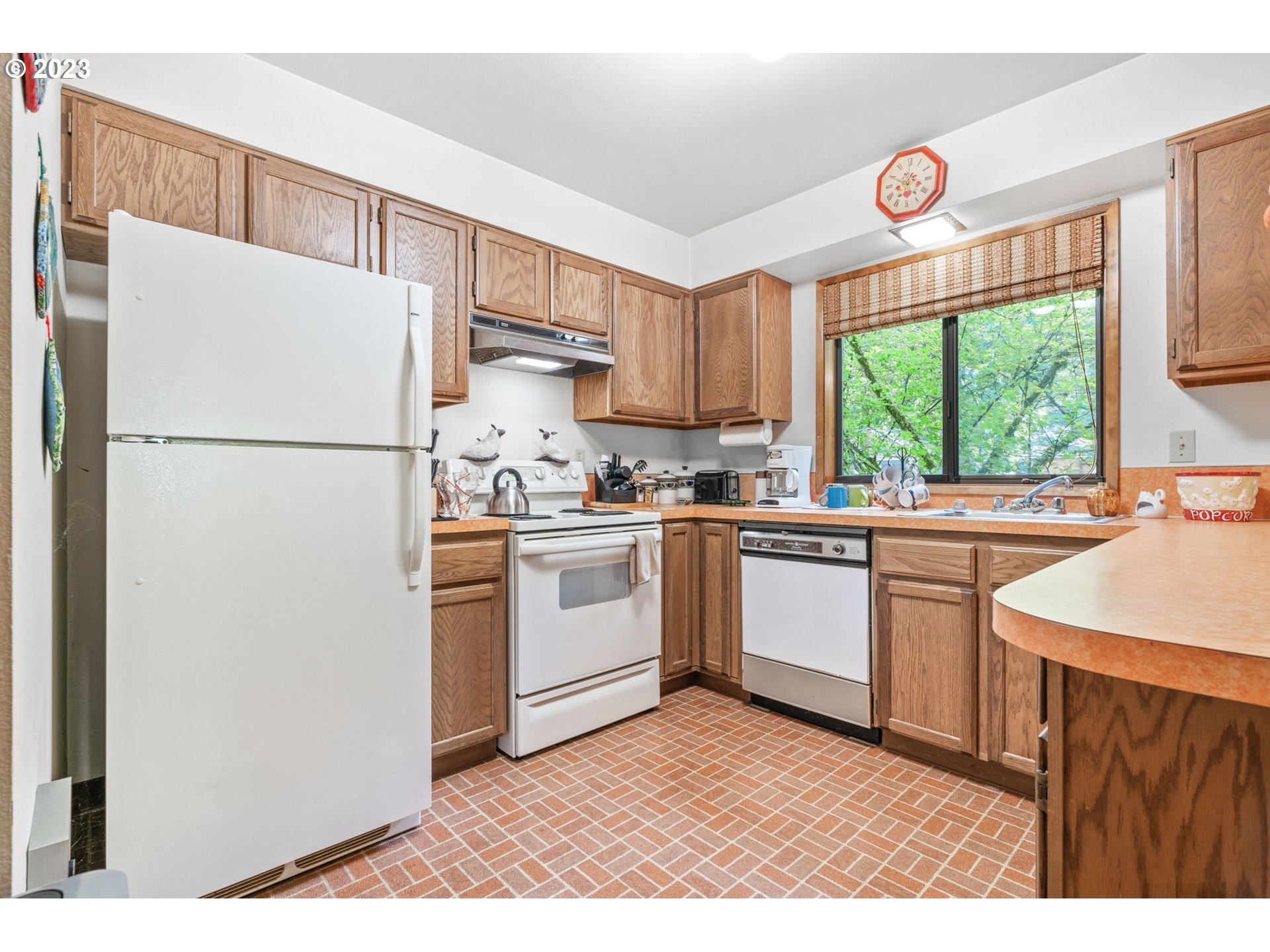 65582 East Timberline Drive Rhododendron, OR 97049 - Photo 13 of 48 a kitchen with a refrigerator a sink and a window
