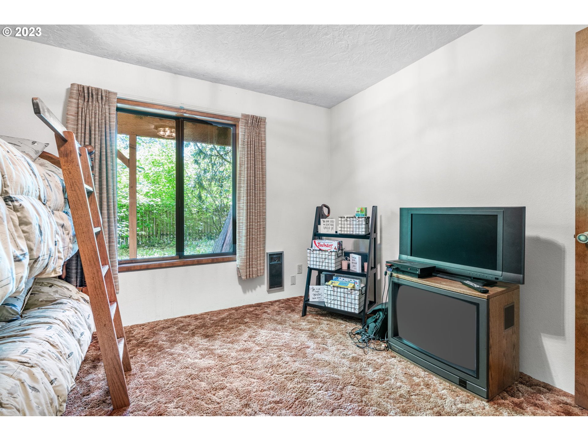 65582 East Timberline Drive Rhododendron, OR 97049 - Photo 19 of 48 a living room with furniture and a flat screen tv