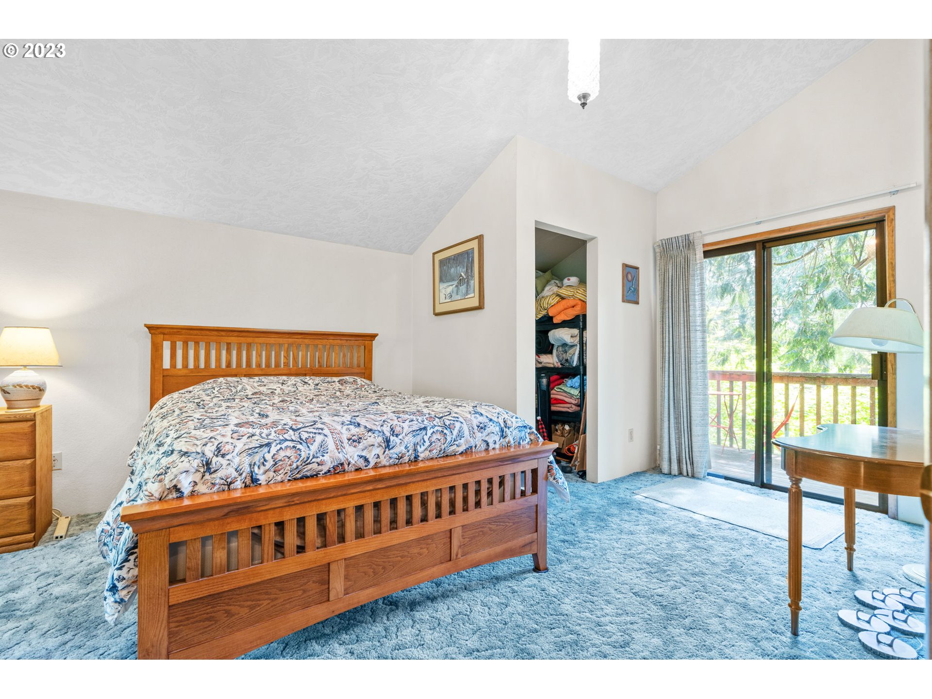 65582 East Timberline Drive Rhododendron, OR 97049 - Photo 20 of 48 a bed room with a bed and a book shelf