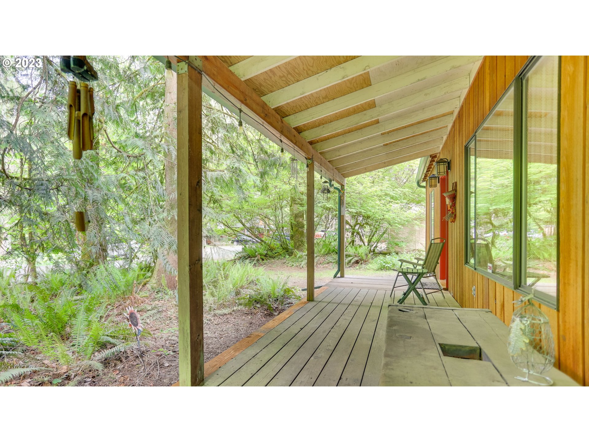 65582 East Timberline Drive Rhododendron, OR 97049 - Photo 7 of 48 a picture of floor to ceiling window next to a yard