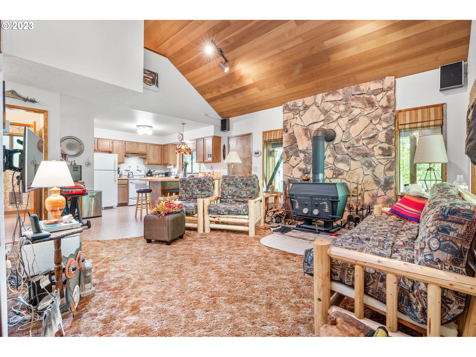 65582 East Timberline Drive Rhododendron, OR 97049 - Photo 8 of 48 a living room filled with furniture and a fireplace