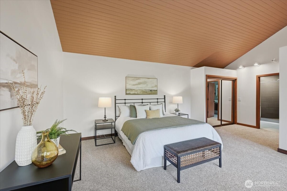 9418 Odin Way Bothell, WA 98011 - Photo 20 of 39 a bedroom with a bed and ceiling fan