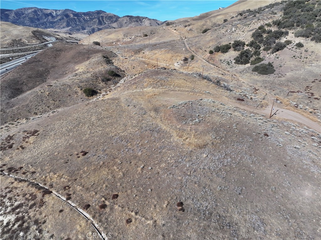 0 Golden State Lebec, CA 93243 - Photo 16 of 23 a view of a dry field with trees in the background