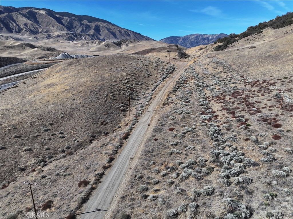 0 Golden State Lebec, CA 93243 - Photo 17 of 23 a view of a dry field with mountains in the background