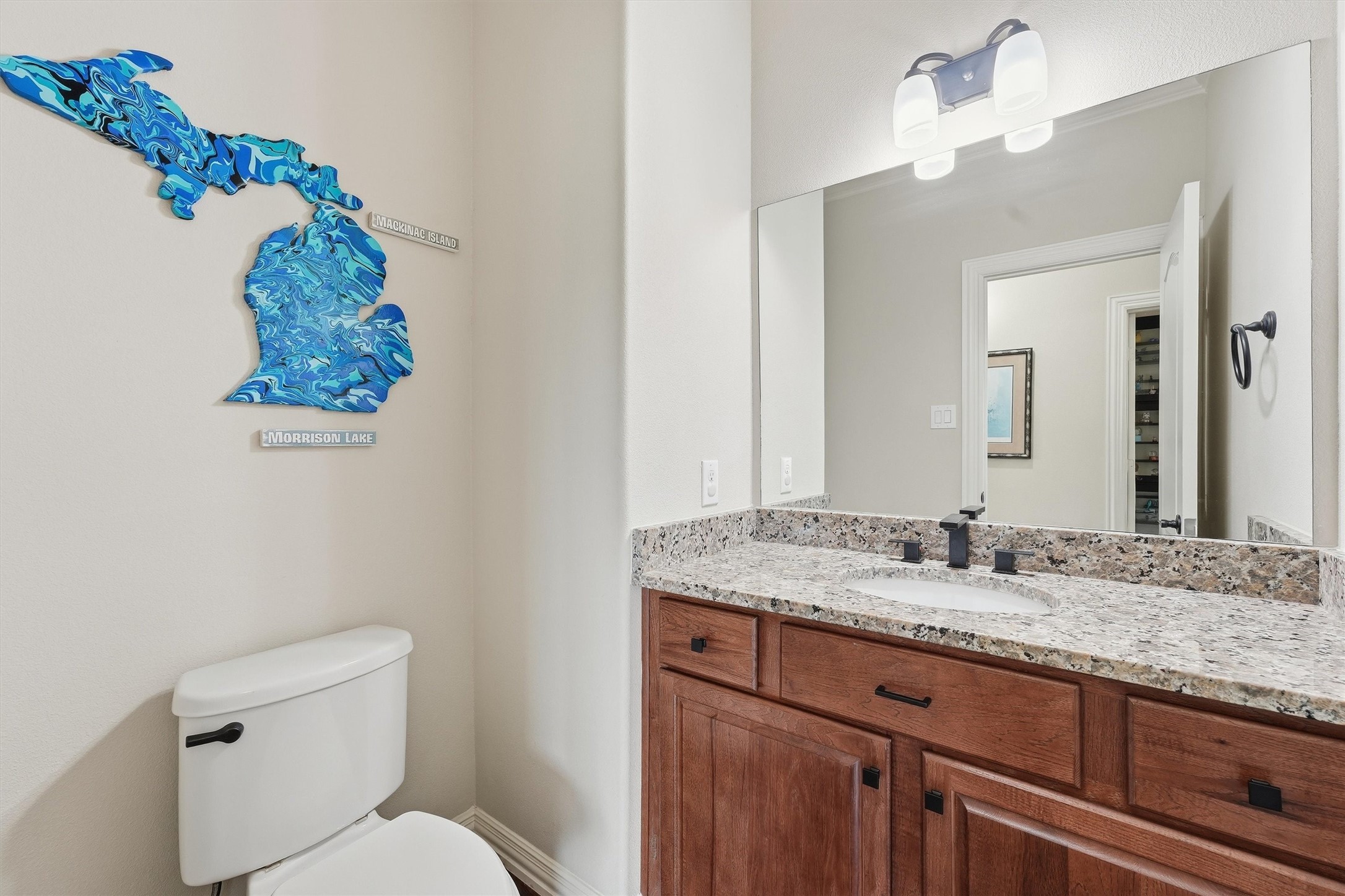 4810 Magnolia Bend Drive Rosharon, TX 77583 - Photo 23 of 40 Secondary/guest bathroom featuring a granite countertop, rich wooden cabinetry, and modern lighting.
