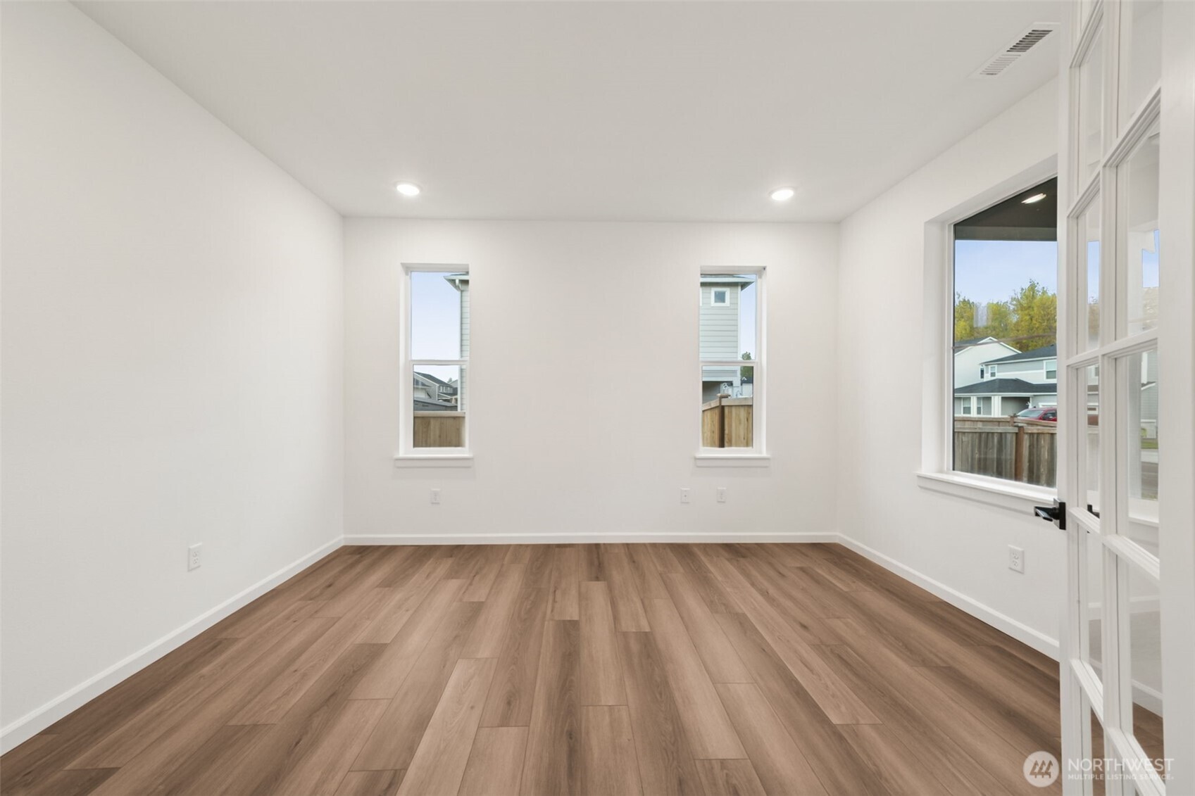 723 South Davis Street, Unit 103 Buckley, WA 98321 - Photo 2 of 13 a view of room with wooden floor and window