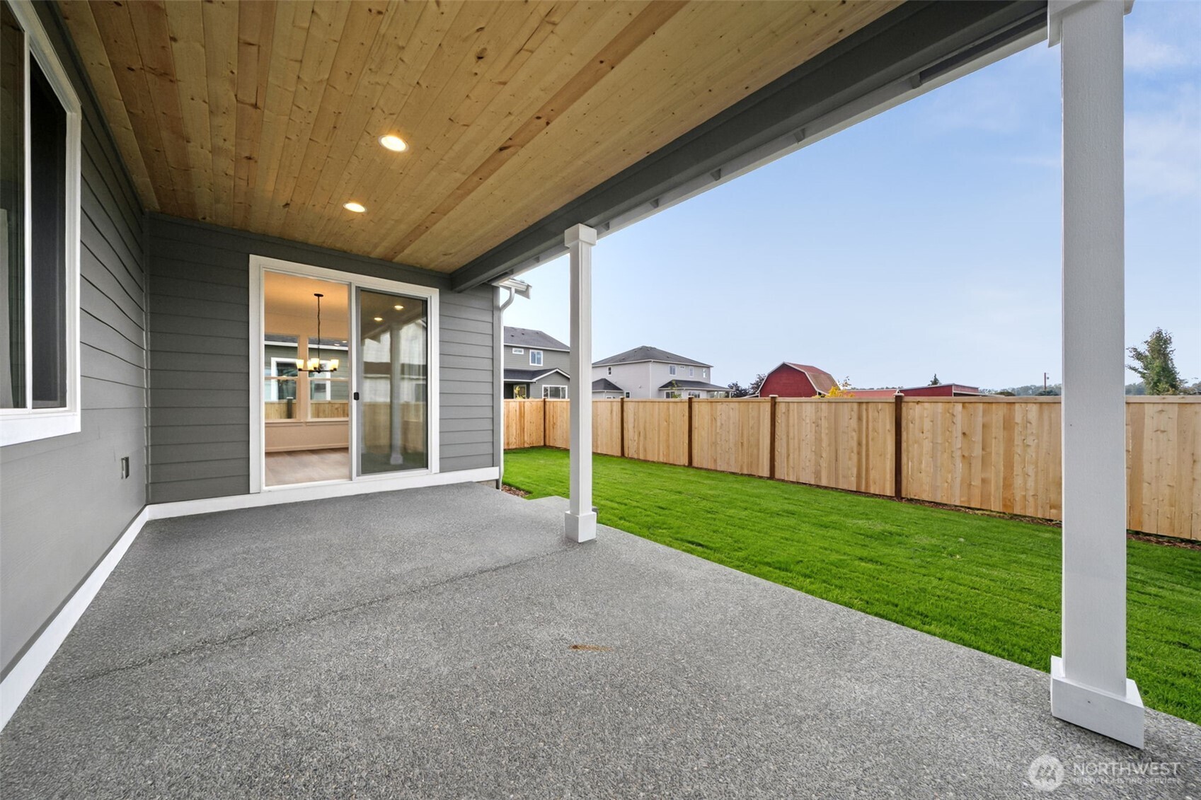 723 South Davis Street, Unit 103 Buckley, WA 98321 - Photo 8 of 13 a view of a backyard with table and chairs and wooden fence