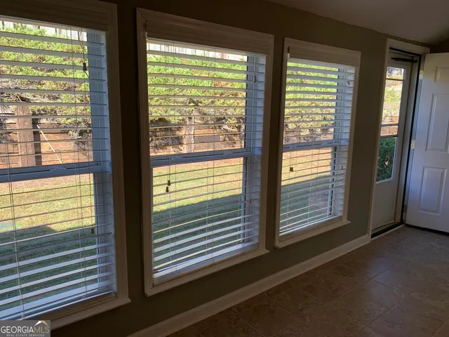 a view of a room that has a large window