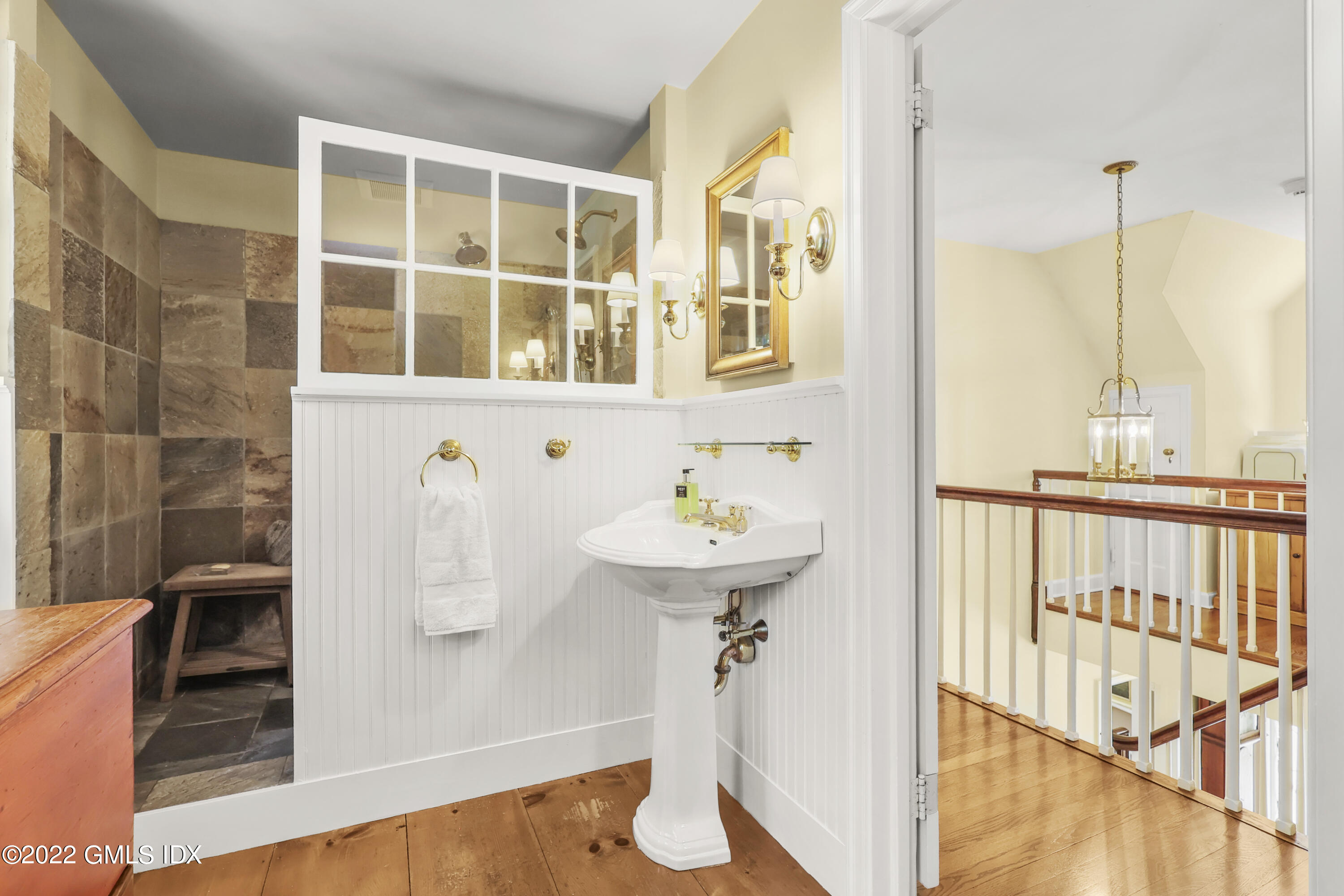 141 Hendrie Avenue Riverside, CT 06878 - Photo 23 of 34 a bathroom with a sink and a mirror