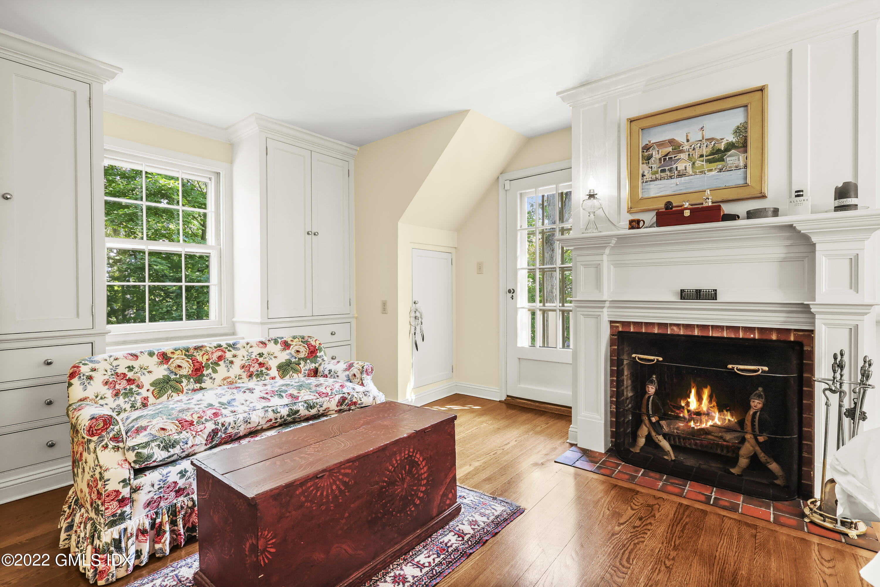141 Hendrie Avenue Riverside, CT 06878 - Photo 26 of 34 a living room with furniture and a fireplace