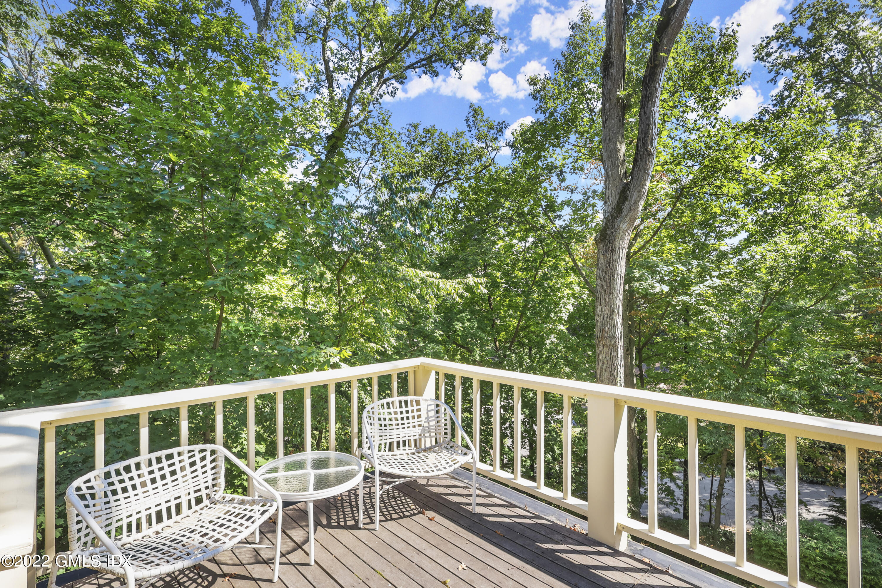 141 Hendrie Avenue Riverside, CT 06878 - Photo 28 of 34 a view of a wooden deck with a large window