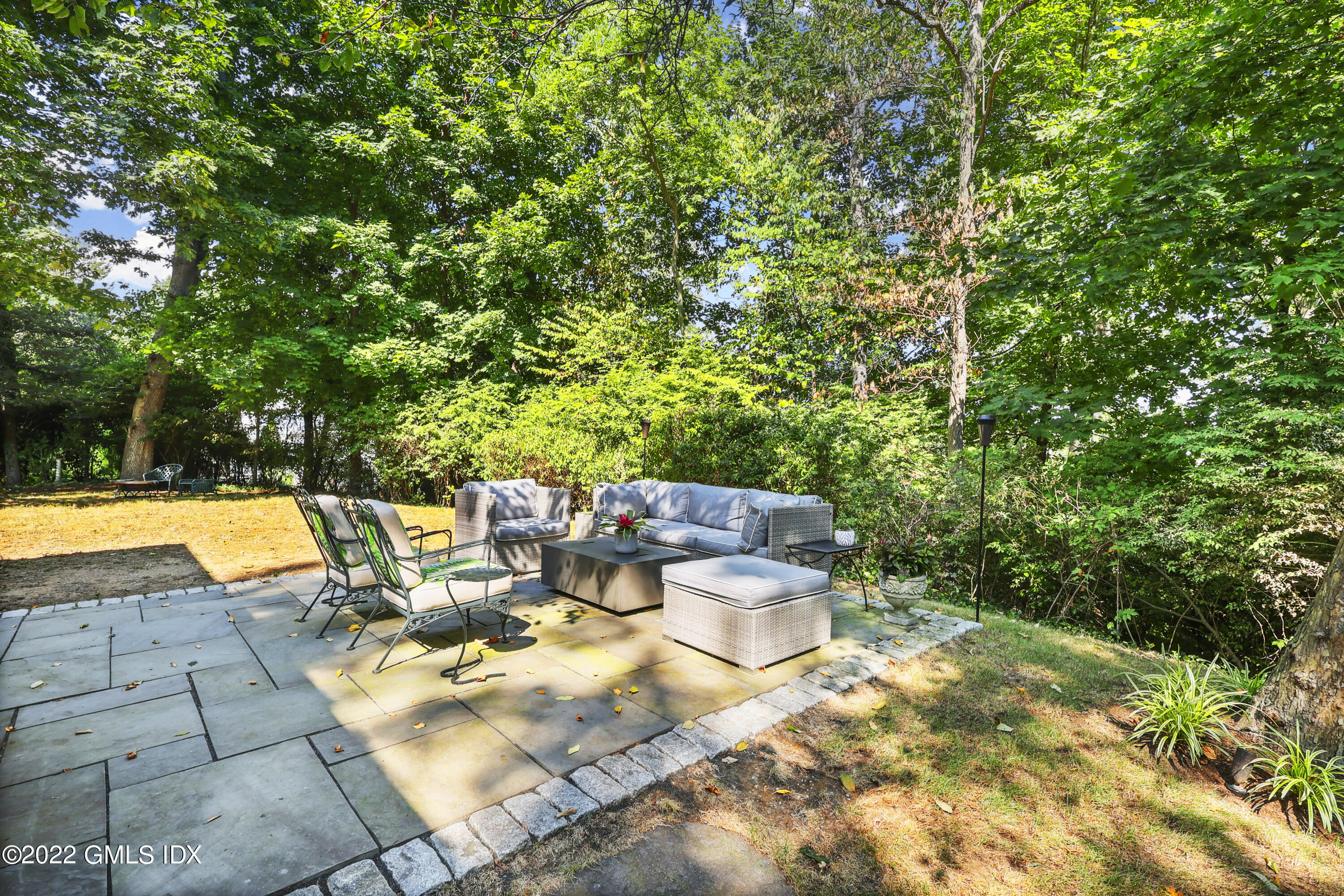 141 Hendrie Avenue Riverside, CT 06878 - Photo 29 of 34 a view of backyard with swimming pool and seating space