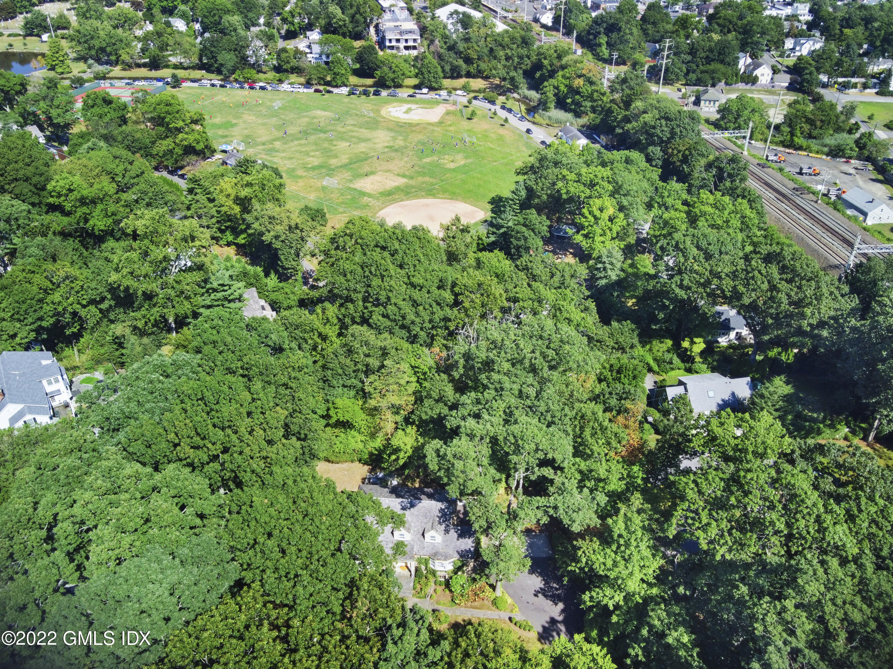 141 Hendrie Avenue Riverside, CT 06878 - Photo 34 of 34 an aerial view of residential house with outdoor space and trees all around