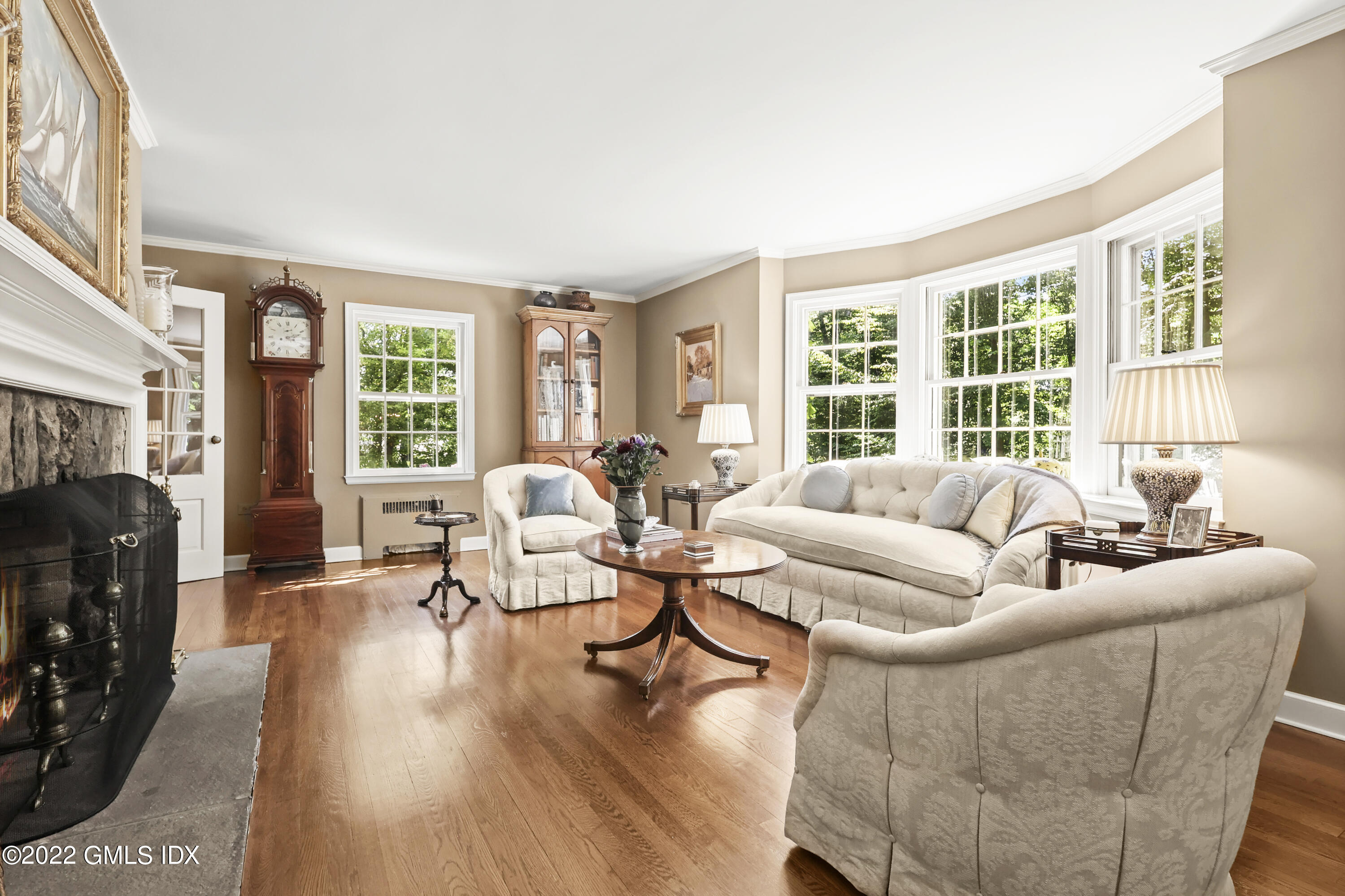 141 Hendrie Avenue Riverside, CT 06878 - Photo 6 of 34 a living room with furniture large windows and wooden floor