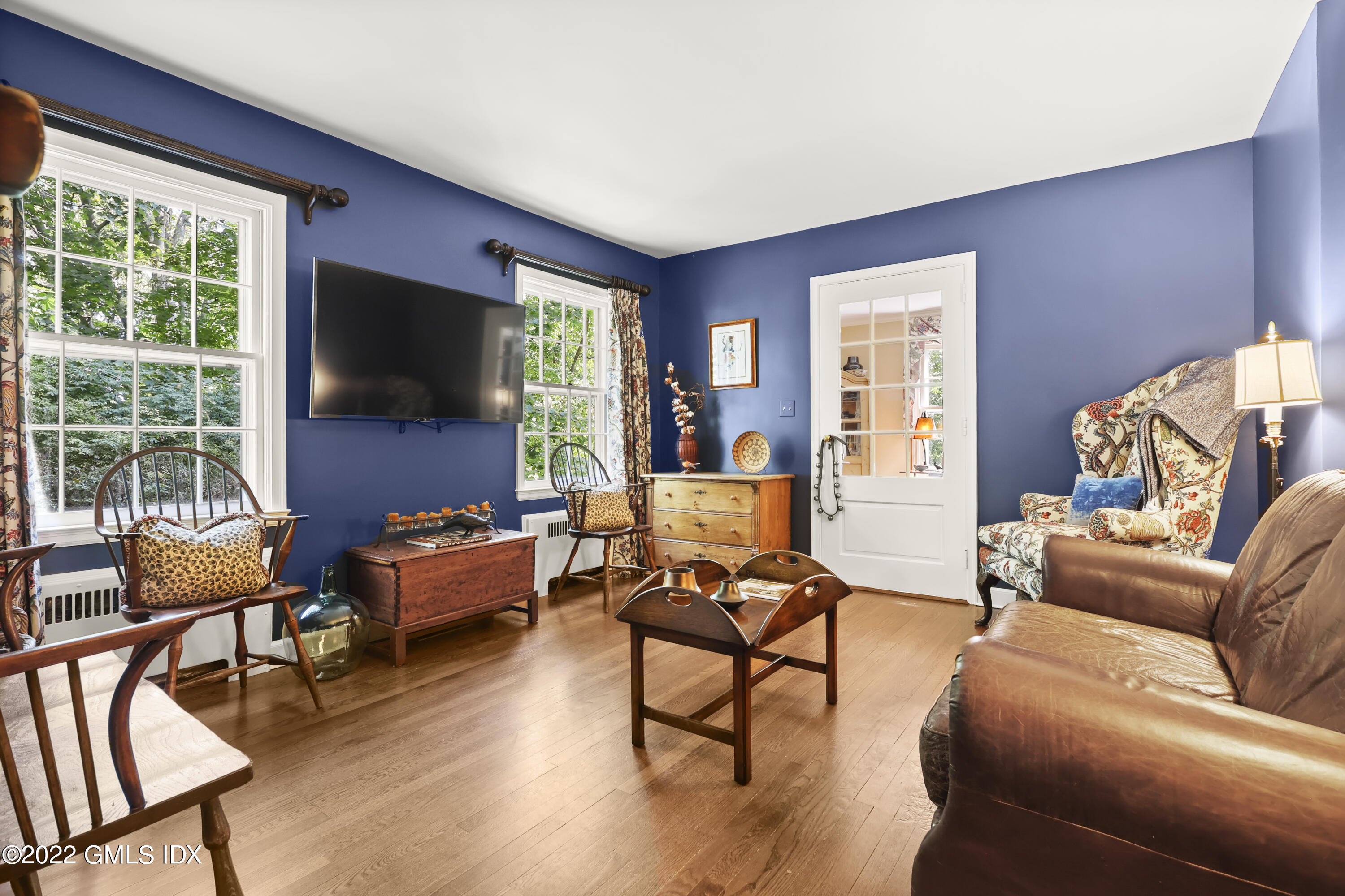 141 Hendrie Avenue Riverside, CT 06878 - Photo 10 of 34 a living room with furniture and a flat screen tv