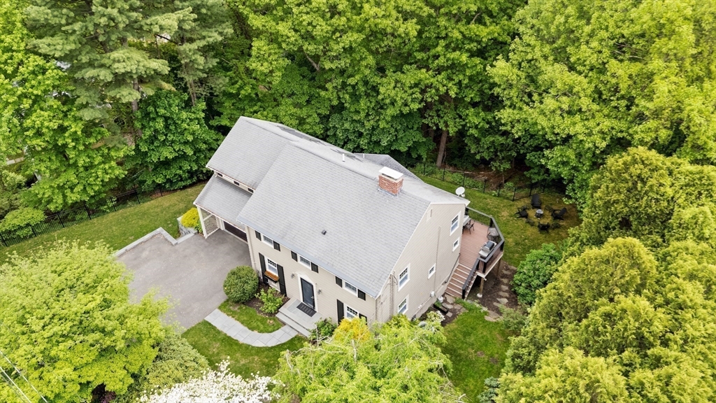 105 Thornberry Road Winchester, MA 01890 - Photo 33 of 35 an aerial view of a house with yard and outdoor seating