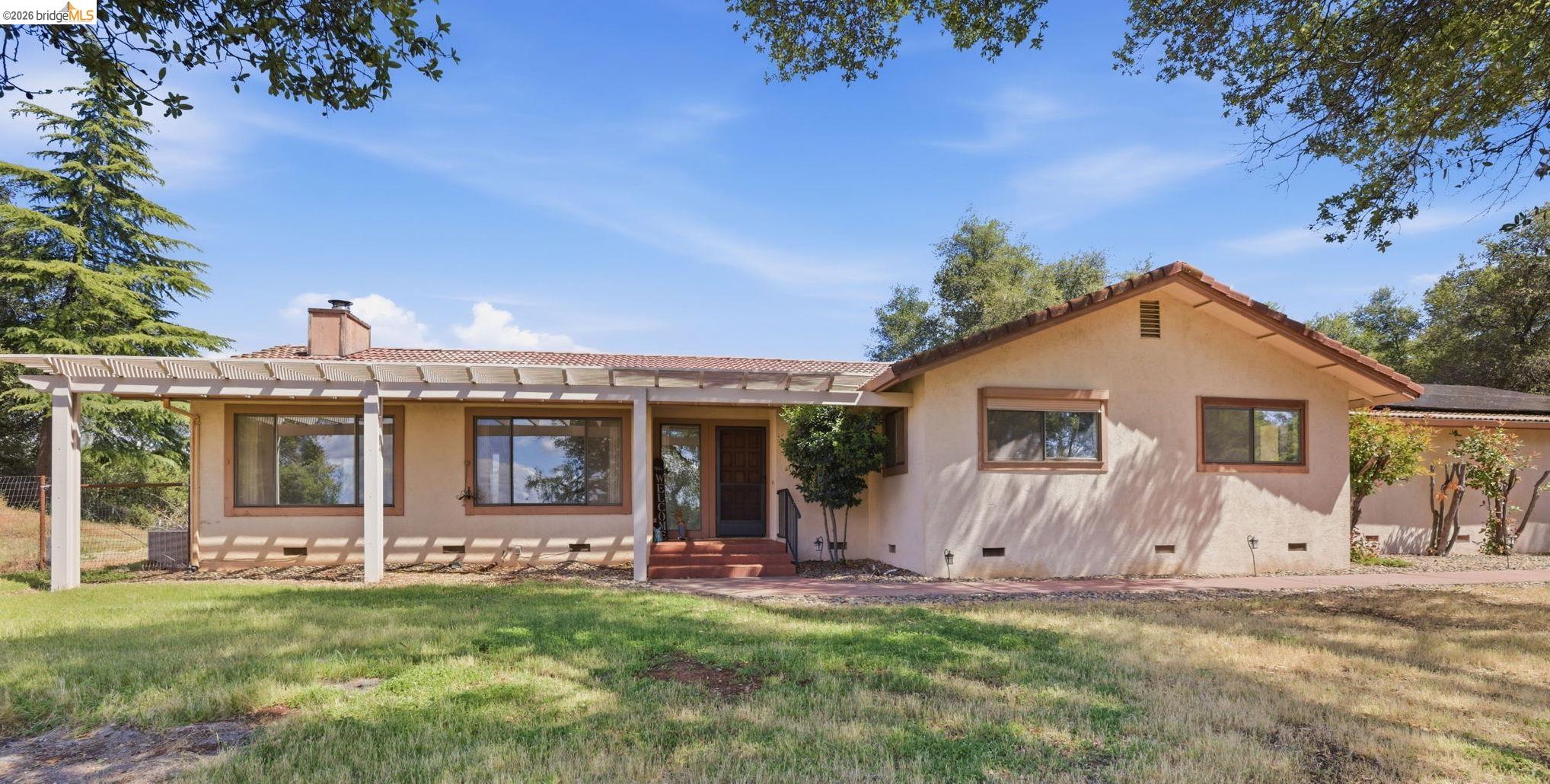 a view of a house with patio