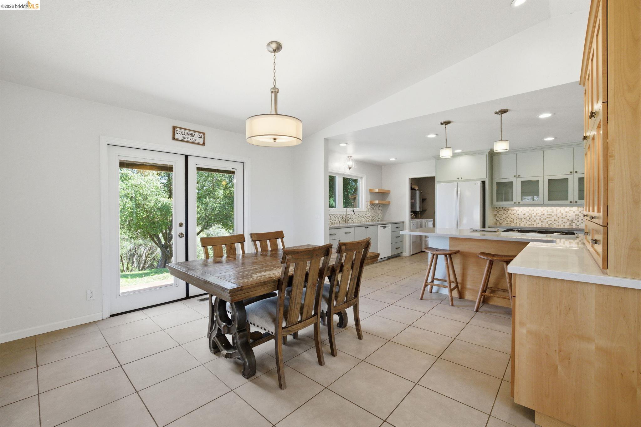 23245 Isabella Court Columbia, CA 95310 - Photo 12 of 34 a dining room with furniture and a floor to ceiling window