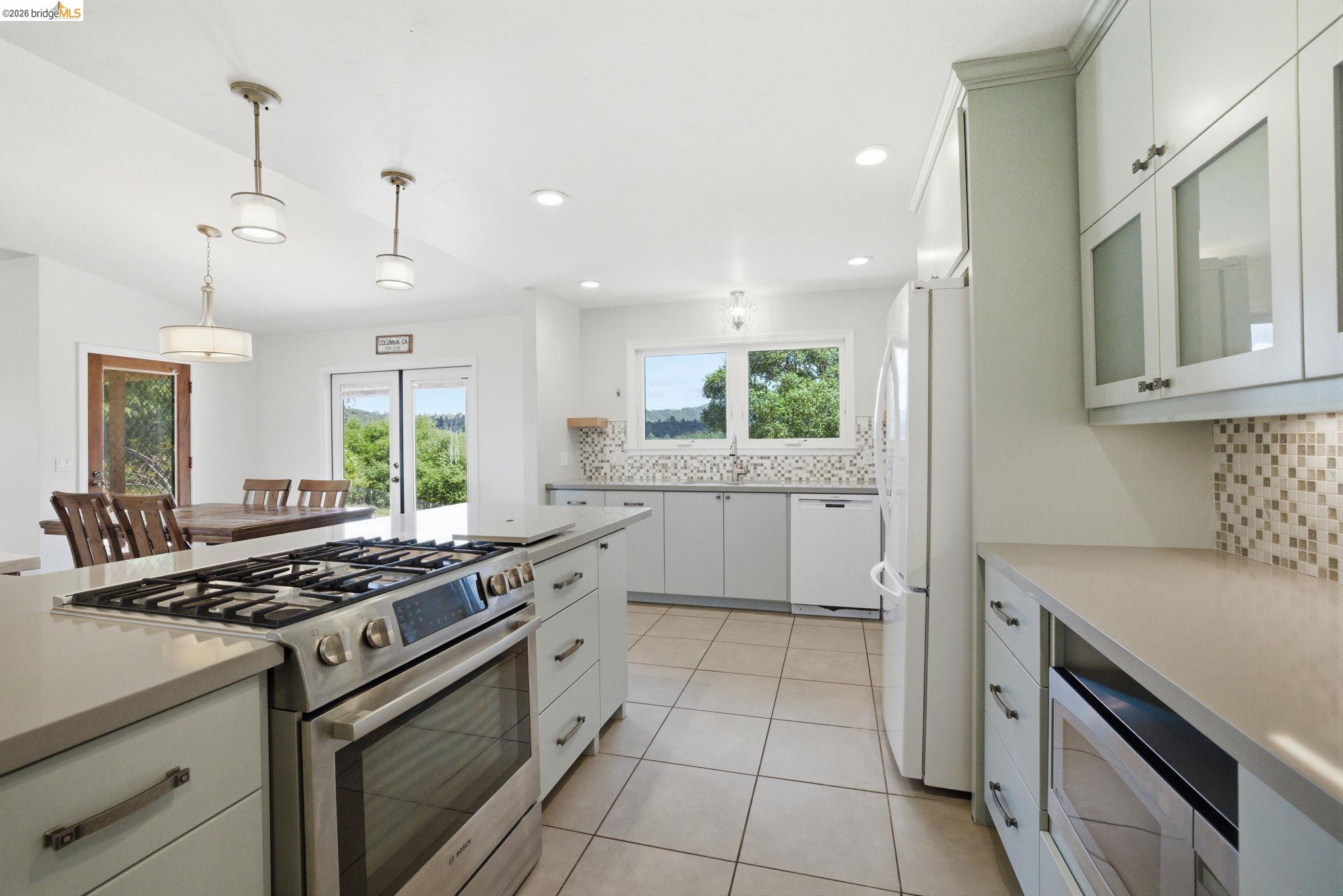 23245 Isabella Court Columbia, CA 95310 - Photo 16 of 34 a kitchen with a stove a sink and a refrigerator