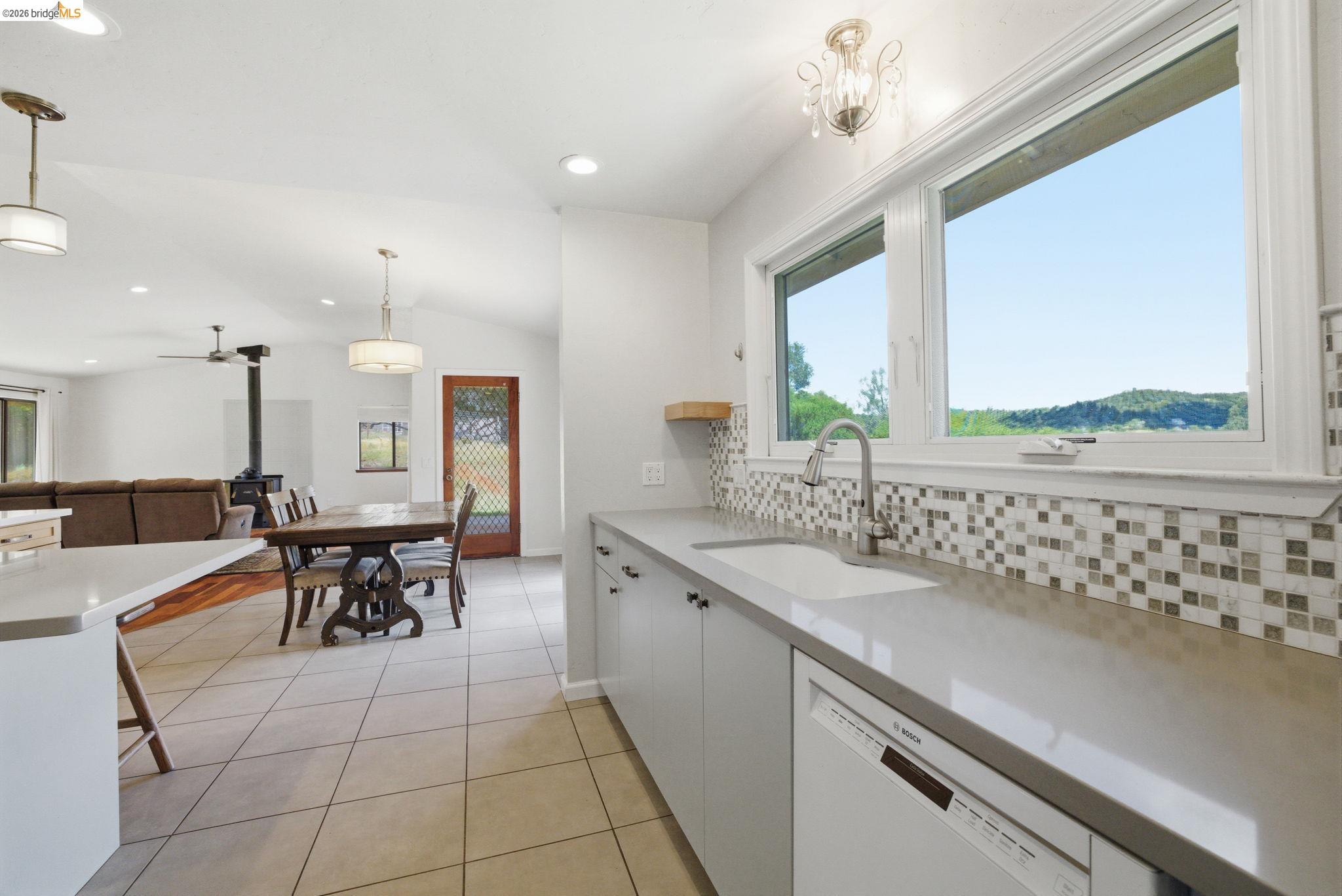 23245 Isabella Court Columbia, CA 95310 - Photo 18 of 34 a large kitchen with a table and chairs