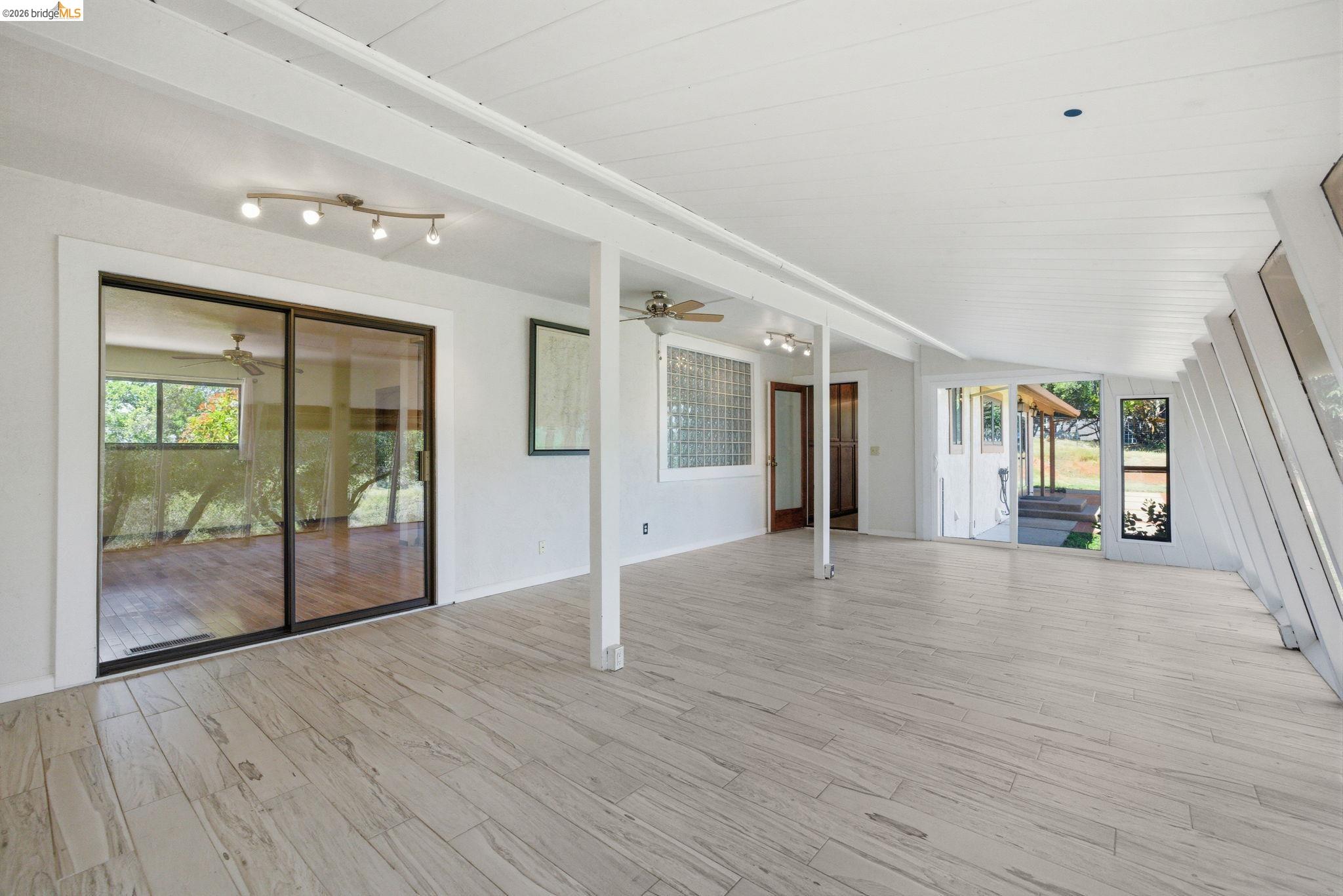 23245 Isabella Court Columbia, CA 95310 - Photo 32 of 34 a view of a big room with wooden floor and windows