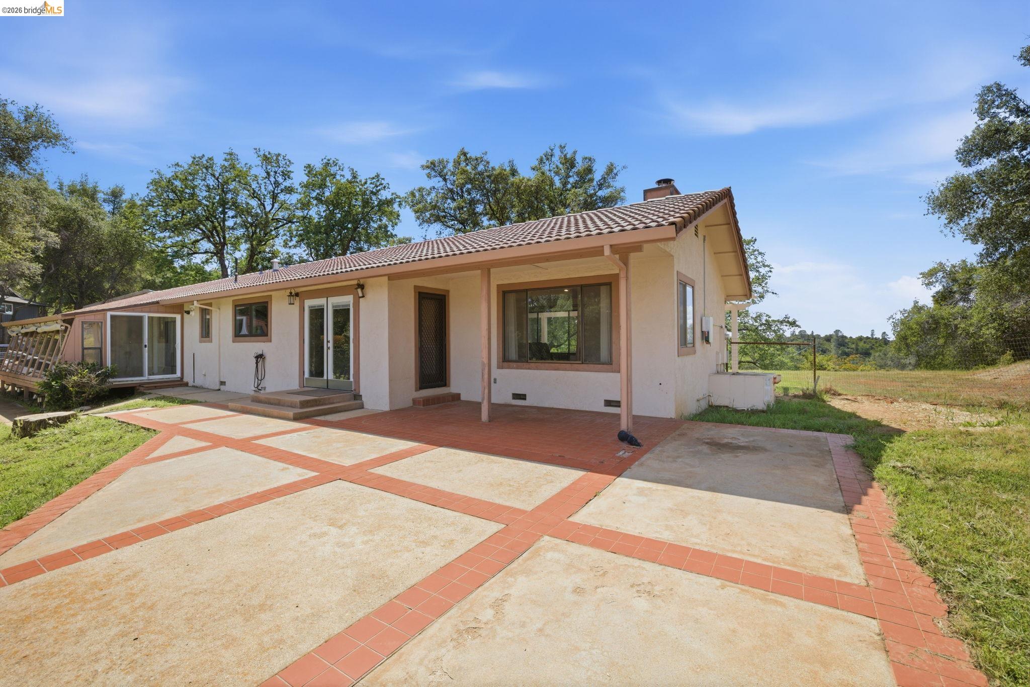 23245 Isabella Court Columbia, CA 95310 - Photo 6 of 34 front view of a house with a patio