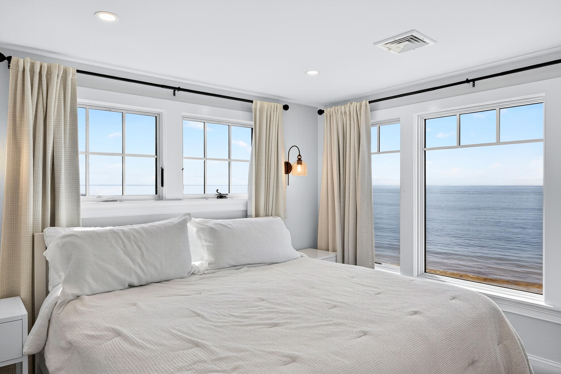 65 Harmes Way Eastham, MA 02642 - Photo 14 of 35 a bedroom with a large bed and a large window
