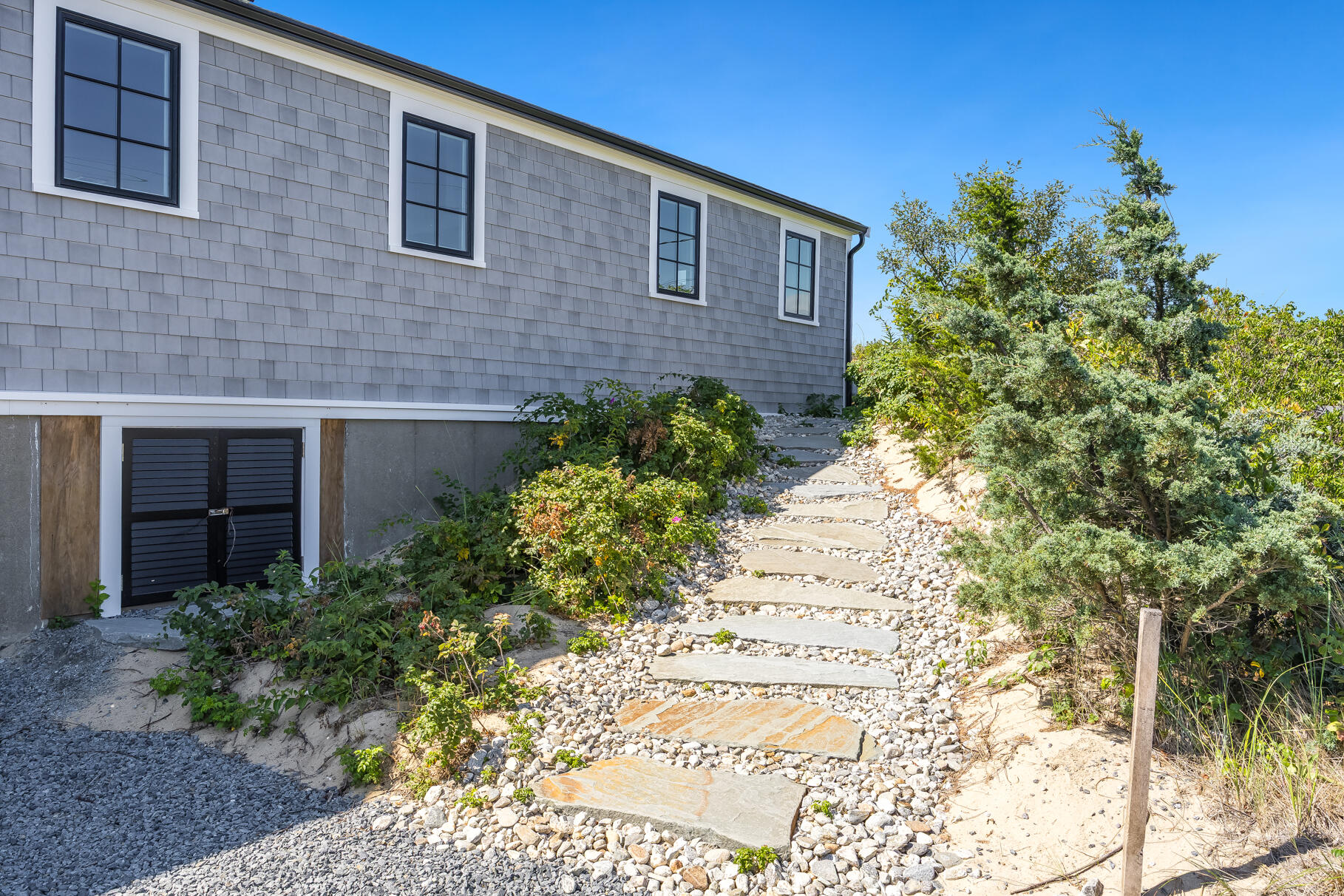 65 Harmes Way Eastham, MA 02642 - Photo 35 of 35 a brick building with a yard