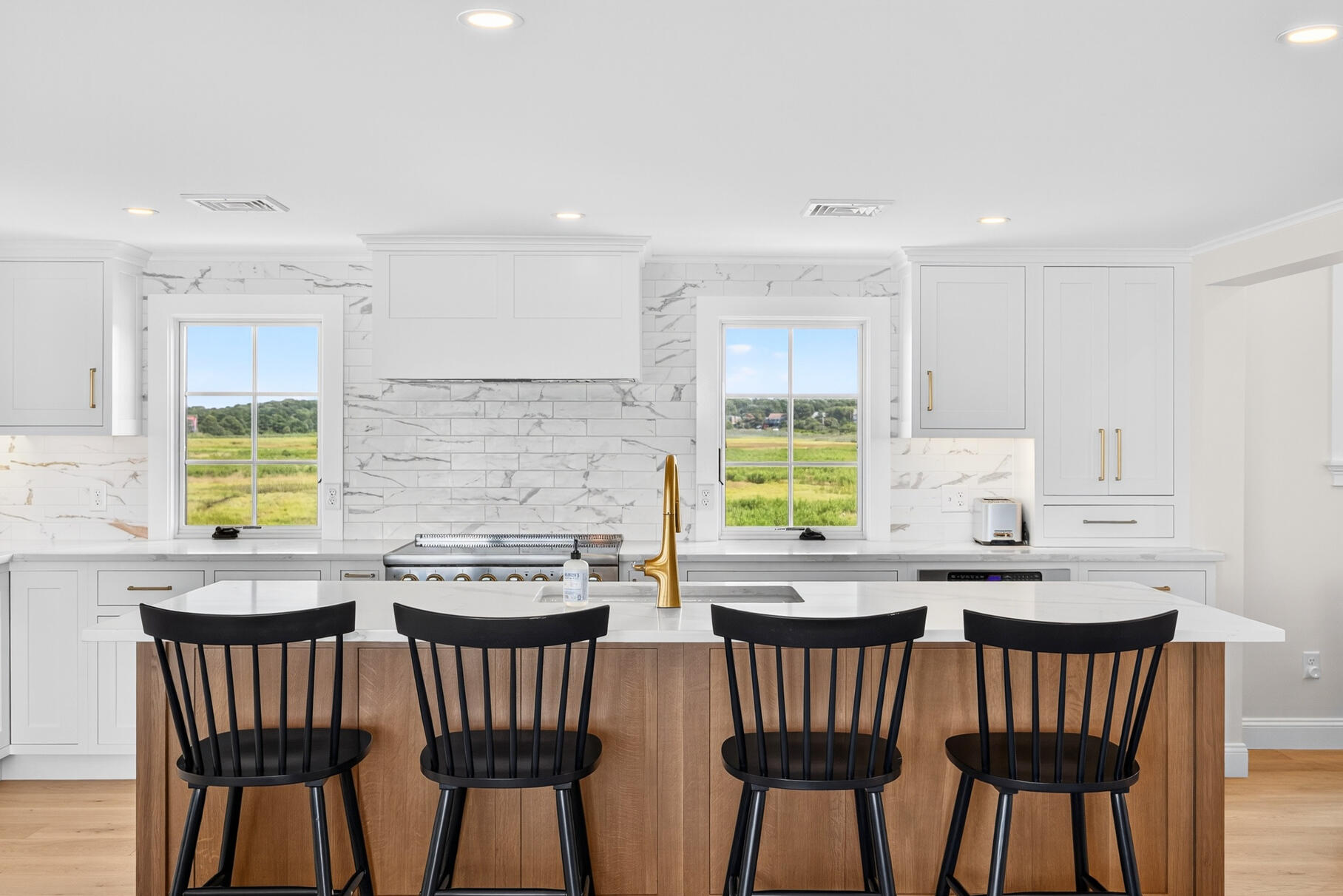 65 Harmes Way Eastham, MA 02642 - Photo 5 of 35 a kitchen with stainless steel appliances granite countertop a dining table chairs and a window